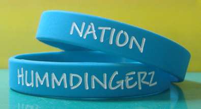 2 blue wristbands on top of eachother